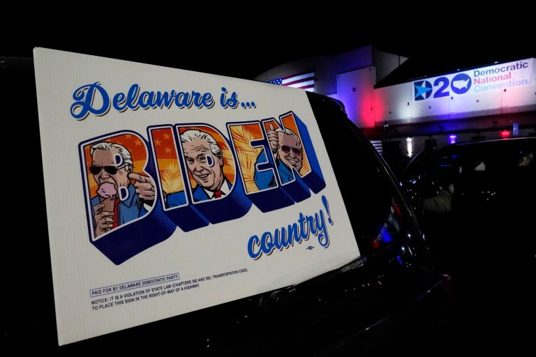Supporters watch the program outside the venue where Democratic presidential candidate former Vice President Joe Biden spoke to the Democratic National Convention, Thursday, Aug. 20, 2020, at the Chase Center in Wilmington, Del.
