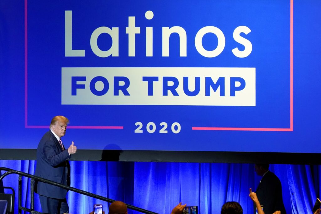 President Donald Trump give a thumbs up to the cheering crowd after a Latinos for Trump Coalition roundtable Monday, Sept. 14, 2020, in Phoenix.