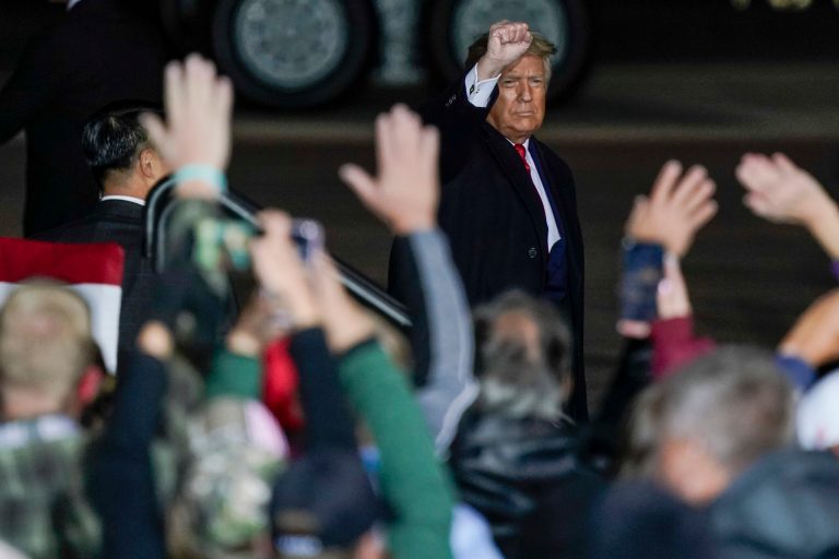 President Donald Trump waves to the crowd after speaking at a campaign rally at the Central Wisconsin Airport Thursday in Mosinee, Wis.