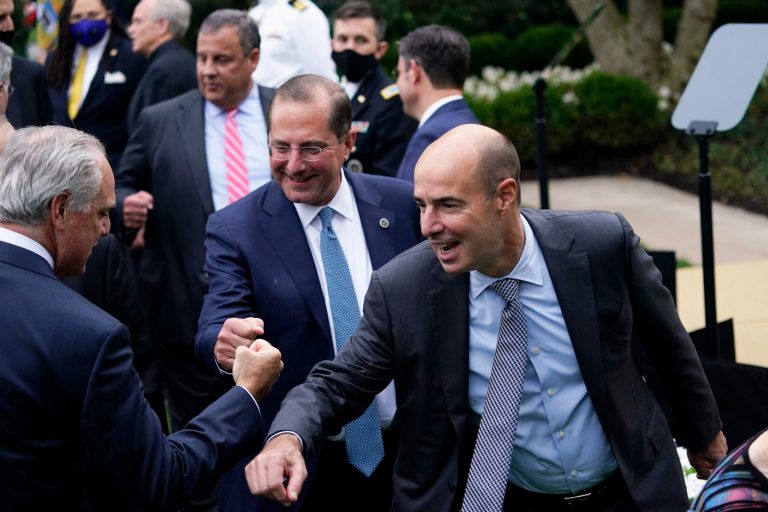 From right, Labor Secretary Eugene Scalia, Health and Human Services Secretary Alex Azar greet people after President Donald Trump announced Judge Amy Coney Barrett as his nominee to the Supreme Court, in the Rose Garden at the White House, Saturday, Sept. 26, 2020, in Washington.