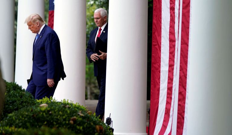 President Donald Trump arrives with Vice President Mike Pence to speak about coronavirus testing during an event in the Rose Garden of the White House, Monday, Sept. 28, 2020, in Washington.