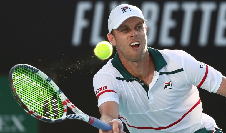FILE - In this Friday, Jan. 24, 2020 file photo, Sam Querrey of the U.S. makes a forehand return to compatriot Tennys Sandgren during their third round singles match at the Australian Open tennis championship in Melbourne, Australia. U.S. tennis player Sam Querrey was placed in isolation by Russian authorities after testing positive for the coronavirus but left the country on a private plane, organizers of the St. Petersburg Open said on Thursday Oct. 15, 2020. (AP Photo/Dita Alangkara, File)