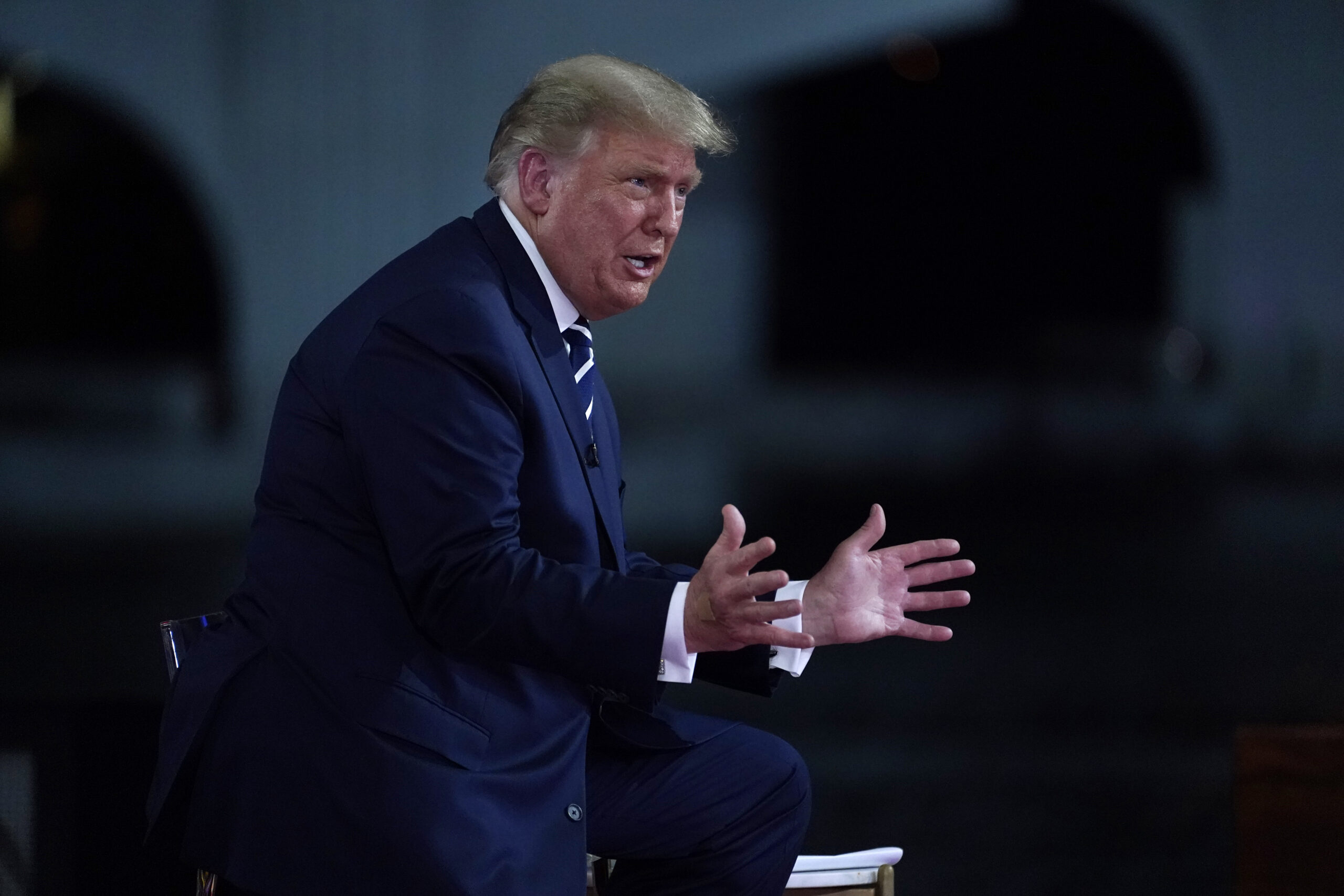 Woman seated behind Trump nodding to his answers at town hall catches social media’s eye