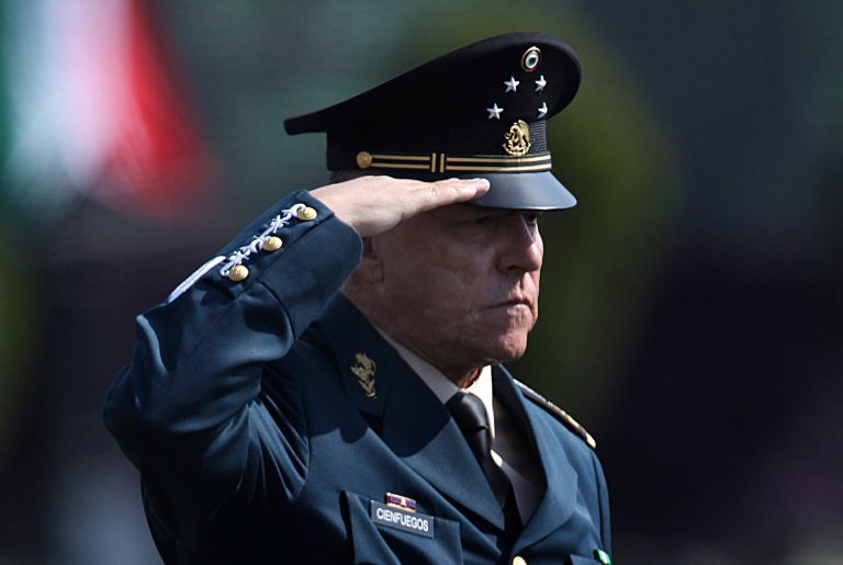 FILE - In this April 16, 2016 file photo, Mexico's Defense Secretary Gen. Salvador Cienfuegos Zepeda salutes soldiers at the Number 1 military camp in Mexico City. Mexico's Foreign Relations Secretary Marcelo Ebrard wrote in his Twitter account Thursday, Oct. 15, 2020, that U.S. Ambassador Christopher Landau had informed him that Gen. Cienfuegos has been arrested in Los Angeles.