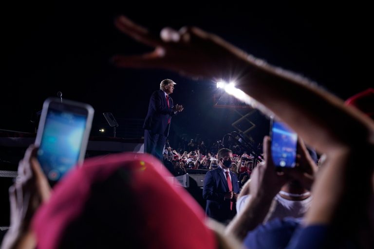 President Donald Trump points to supporters after speaking at a campaign rally at Middle Georgia Regional Airport, Friday, Oct. 16, 2020, in Macon, Ga.