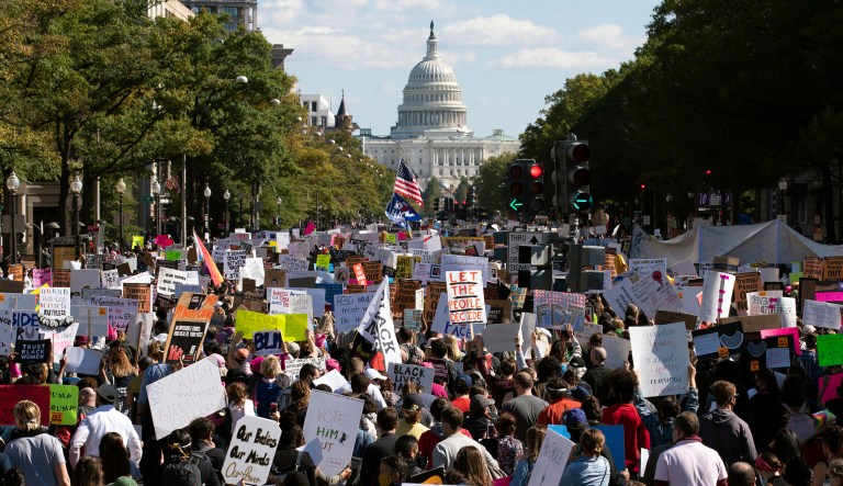 With the U.S Capitol in the background, demonstrators march on Pennsylvania Avenue during the Women's March in Washington on Saturday.