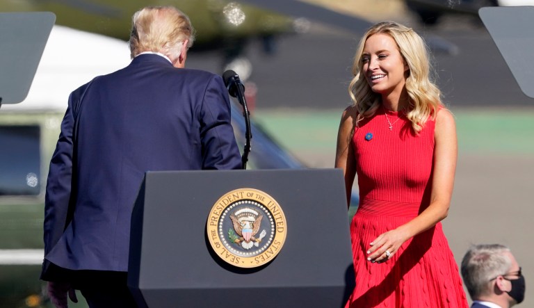 White House press secretary Kayleigh McEnany is called onto the stage by President Donald Trump during a campaign rally, Monday, Oct. 19, 2020, in Prescott, Ariz.
