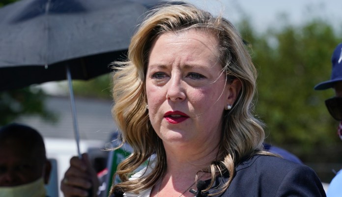 In this Tuesday, Aug. 18, 2020, file photo, U.S. Rep. Kendra Horn, D-Okla., speaks during a news conference in front of a post office in Oklahoma City.