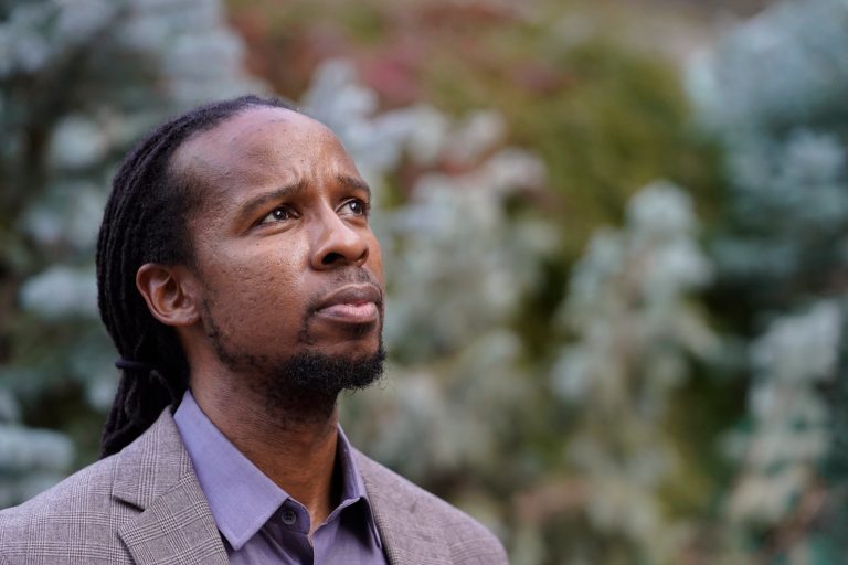 Ibram X. Kendi, director of Boston University's Center for Antiracist Research, stands for a portrait Wednesday, Oct. 21, 2020, in Boston. 