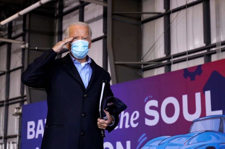 Democratic presidential candidate former Vice President Joe Biden salutes after speaking at a rally at Cleveland Burke Lakefront Airport, Monday, Nov. 2, 2020, in Cleveland. 