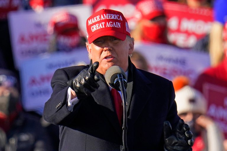 President Donald Trump gestures while addressing a campaign rally at the Wilkes-Barre Scranton International Airport in Avoca, Pa, Monday, Nov. 2, 2020. His campaign is confident of catching up to Joe Biden's early vote lead.