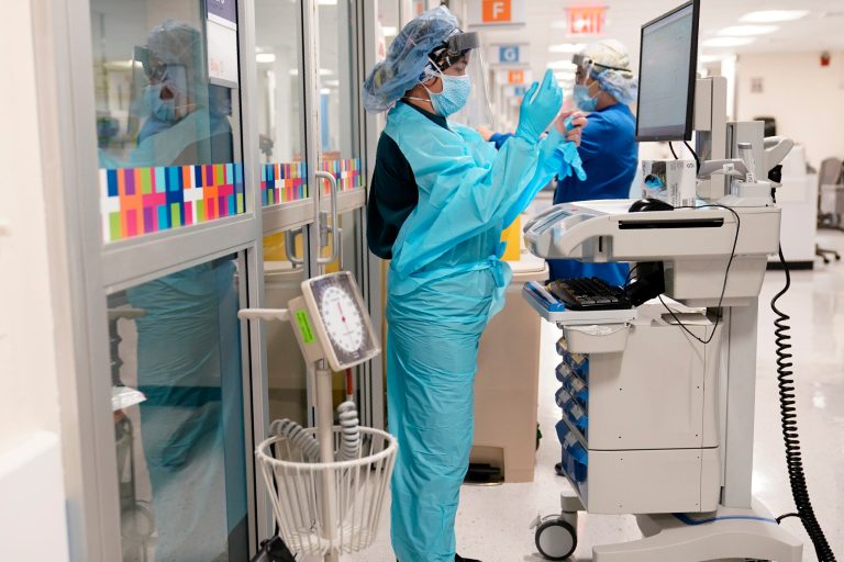 US breaks records on COVID-19 hospitalizations and cases