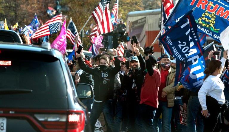 President Trump drives by a group of supporters participating in a rally near the White House, Saturday, Nov. 14, 2020, in Washington.