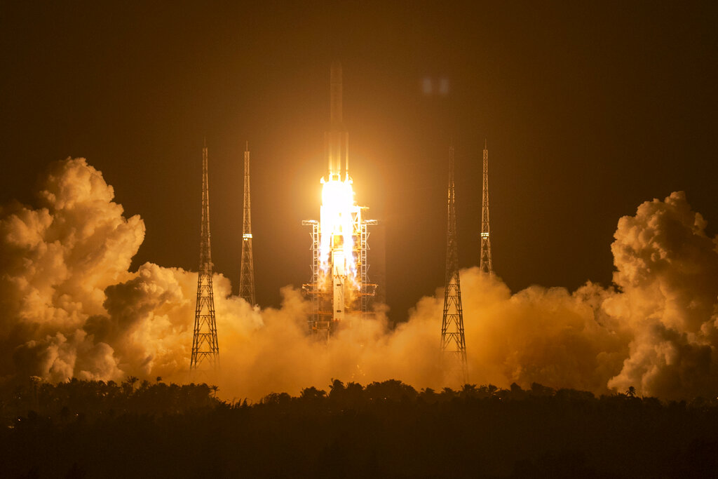 China lands unmanned spacecraft on moon in bid to become third nation to bring lunar samples back to Earth