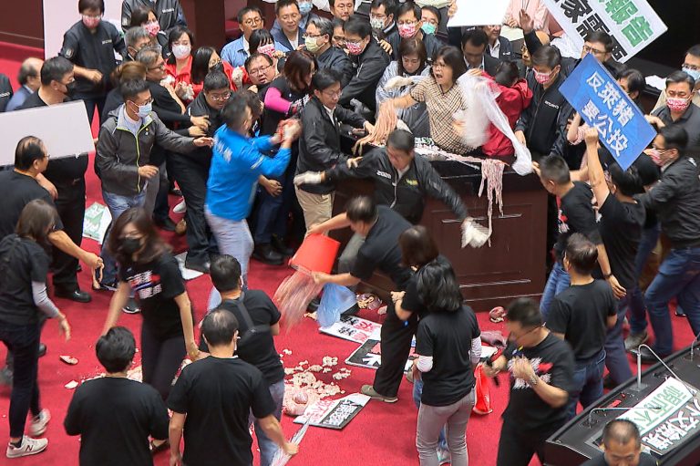 Taiwanese lawmakers throw punches and pig intestines over pork import ban