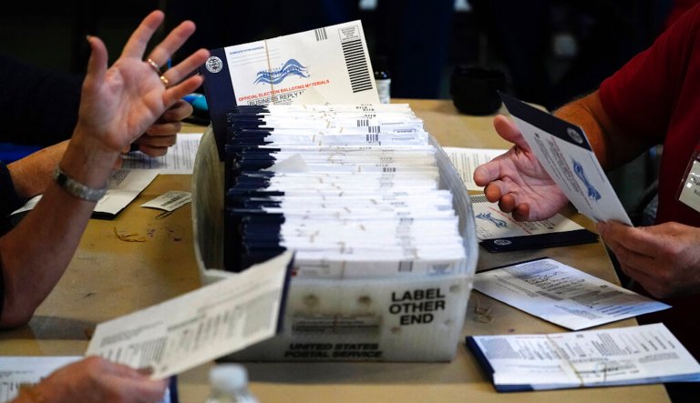 Chester County election workers process mail-in and absentee ballots for the 2020 general election in the United States at West Chester University, Wednesday, Nov. 4, 2020, in West Chester, Pa.