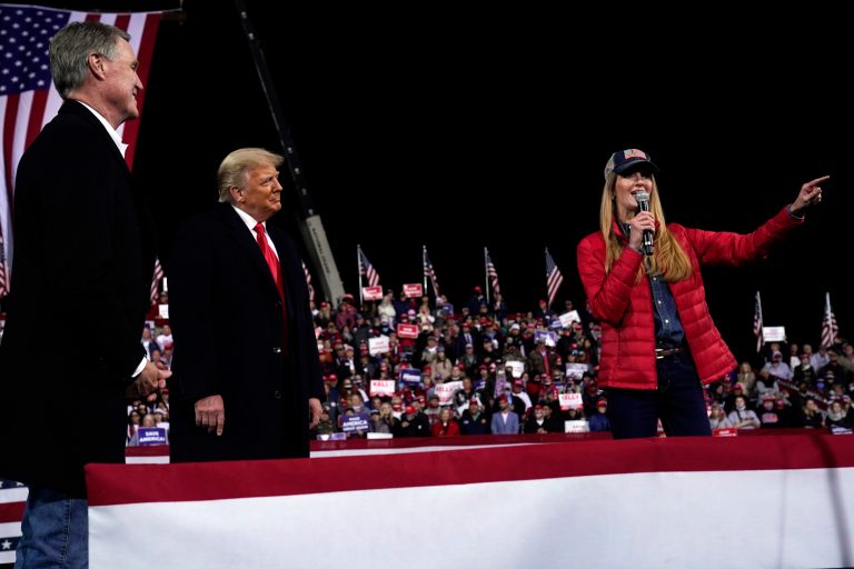 Sen. Kelly Loeffler, R-Ga., speaks as President Trump and Sen. David Perdue, R-Ga., listen at a campaign rally at Valdosta Regional Airport, Saturday, Dec. 5, 2020, in Valdosta, Ga.