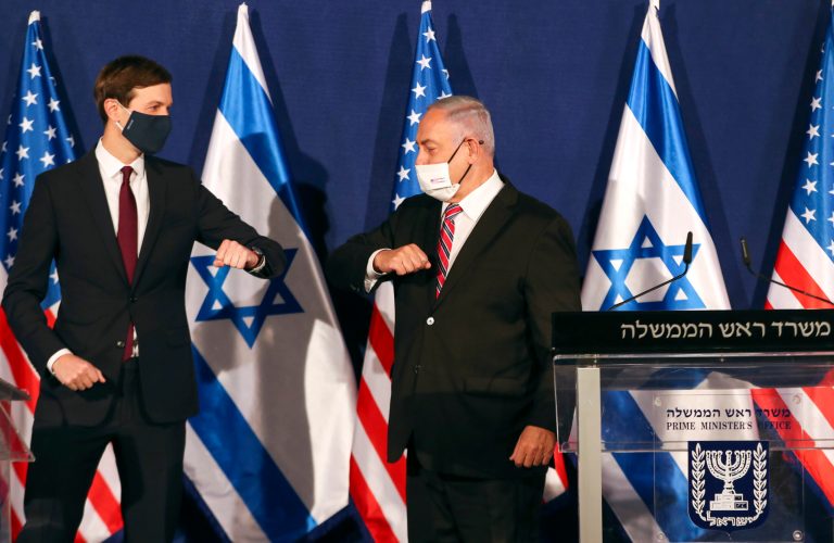 White House senior adviser Jared Kushner, left, elbow bumps Israeli Prime Minister Benjamin Netanyahu during a news conference in Jerusalem, Monday, Dec. 21, 2020.