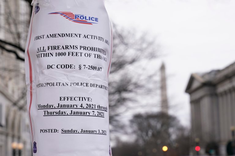 A sign is posted near the White House in preparation for a rally on Jan. 6, the day when Congress is scheduled to meet to formally finalize the presidential election results.