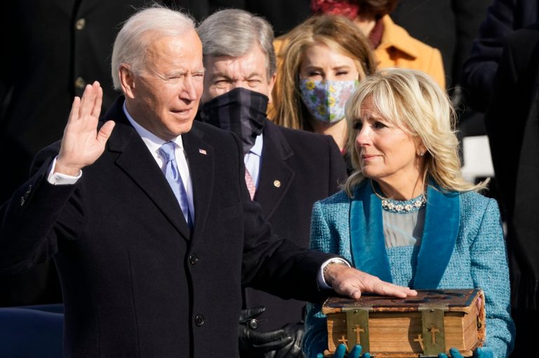 Joe Biden is sworn in as the 46th president of the United States by Chief Justice John Roberts as Jill Biden holds the Bible during the 59th Presidential Inauguration at the U.S. Capitol in Washington, Wednesday, Jan. 20, 2021.