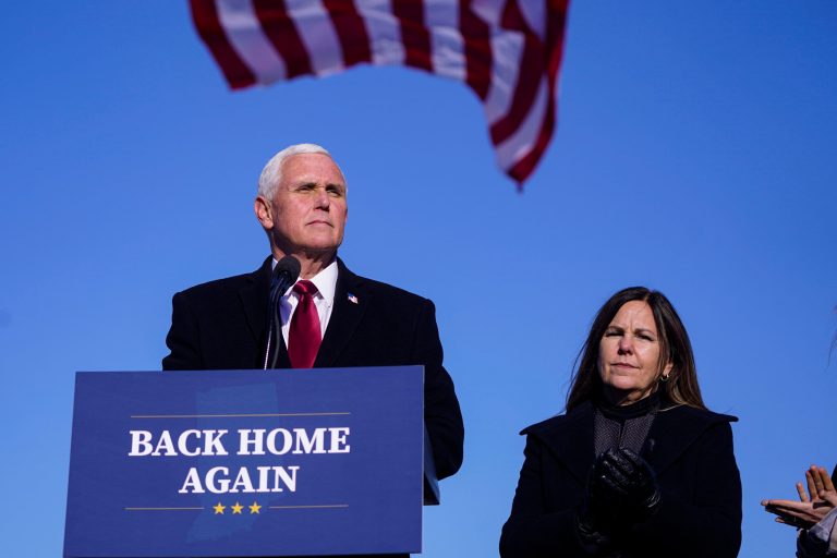 Former Vice President Mike Pence, shown with his wife Karen, speaks after arriving back in his hometown of Columbus, Ind., Wednesday, Jan. 20, 2021.