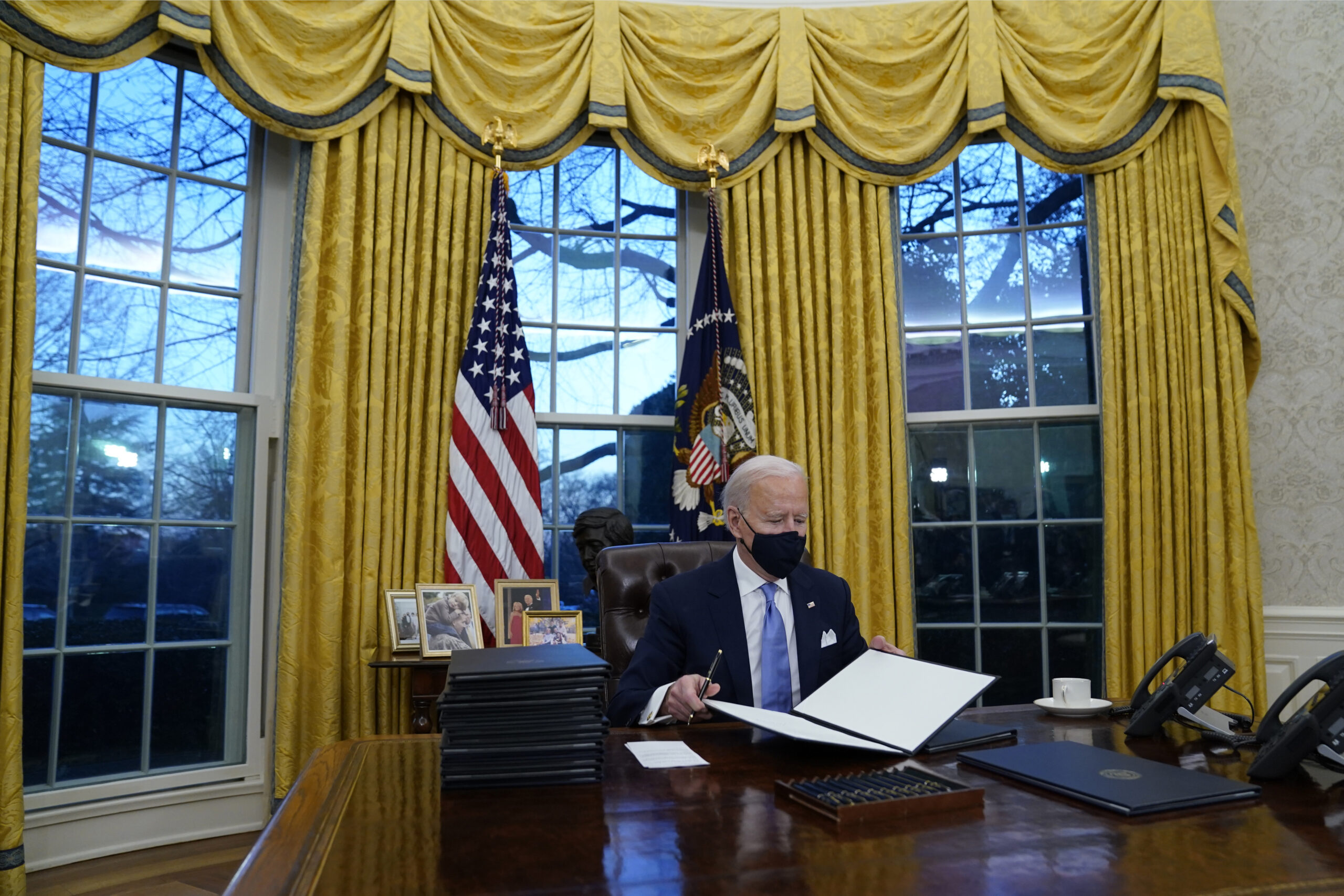 Biden removes military flags Trump had displayed in Oval Office and adds busts MLK Jr. and socialist activist Cesar Chavez
