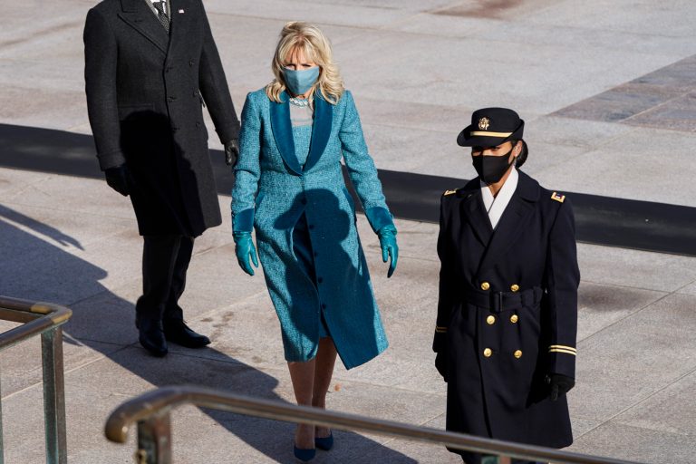 First lady Jill Biden walks before U.S. President Joe Biden as they arrive to lay a wreath at the Tomb of the Unknown Soldier at Arlington National Cemetery, in Arlington, Virginia, Wednesday, Jan. 21, 2021. 