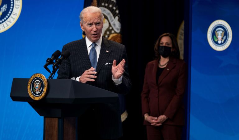 Vice President Kamala Harris listens as President Joe Biden answers questions from reporters in the South Court Auditorium on the White House complex, Monday, Jan. 25, 2021, in Washington.