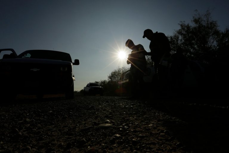 Border Patrol agents stop men thought to have entered the country illegally, near McAllen, Texas, along the U.S.-Mexico border. President Joe Biden is rushing to wipe out some of his predecessor's toughest immigration measures to fortify the U.S.-Mexico border.