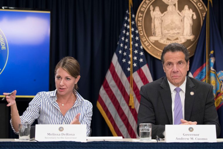 In this Sept. 14, 2018 file photo, Secretary to the Governor Melissa DeRosa, is joined by New York Gov. Andrew Cuomo as she speaks to reporters during a news conference, in New York. 