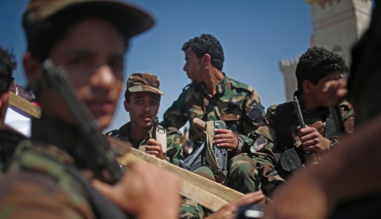 Houthi fighters ride on a vehicle as they attend a funeral procession of Houthi fighters who were killed in recent fighting with forces of Yemen's international recognized government in Sanaa, Yemen, Tuesday, Feb. 16, 2021.