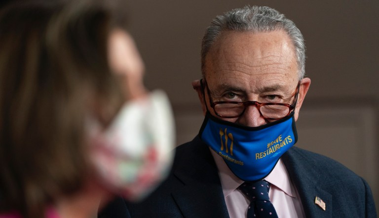 Senate Majority Leader Chuck Schumer, D-N.Y., right, watches as House Speaker Nancy Pelosi of Calif., speaks about the Congress Equality Act, Thursday, Feb. 25, 2021, on Capitol Hill in Washington.