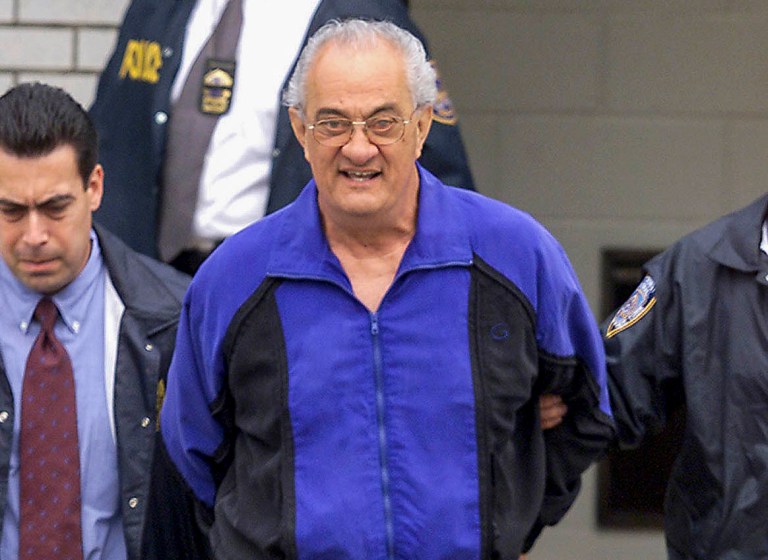 FILE - In this June 4, 2002, file photo, Peter Gotti, center, is escorted out of the Waterfront Commission following his arrest in the Brooklyn borough of New York. (Mike Albans/The Daily News via AP, File)