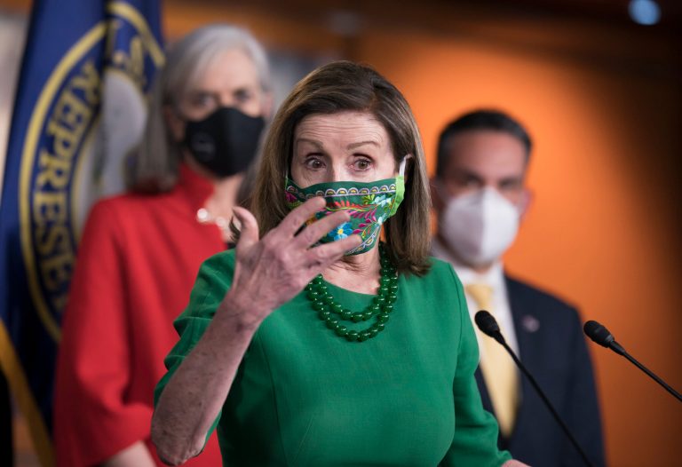 Speaker of the House Nancy Pelosi, D-Calif., meets with reporters before the House votes to pass a $1.9 trillion pandemic relief package. Pelosi is flanked by Rep. Katherine Clark, D-Mass., left, and Rep. Pete Aguilar, D-Calif.