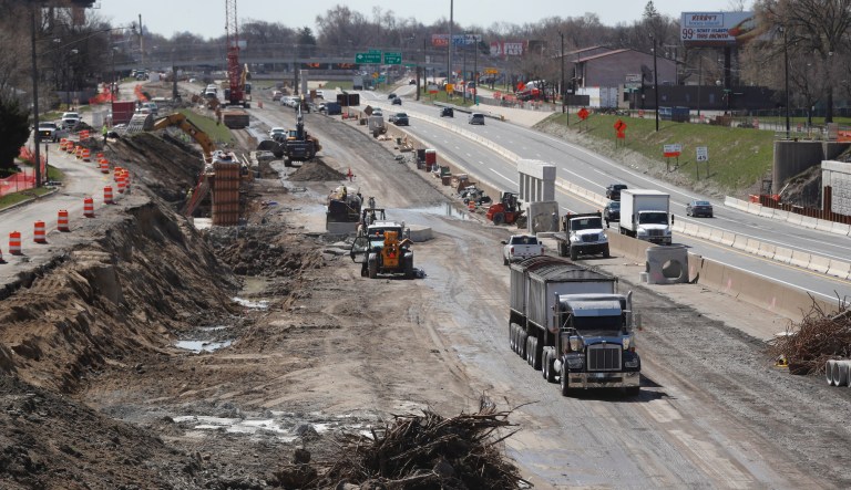 In this April 20, 2020, file photo work continues on the Interstate Highway 75 project in Hazel Park, Mich. Looking beyond the $1.9 trillion COVID relief bill, President Joe Biden and lawmakers are laying the groundwork for another of his top legislative priorities â a long-sought boost to the nation's roads, bridges and other infrastructure that could meet GOP resistance to a hefty price tag.
