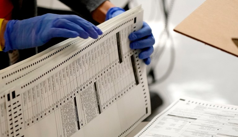 Maricopa County elections officials count ballots, Wednesday, Nov. 4, 2020, at the Maricopa County Recorders Office in Phoenix.
