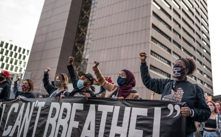 Demonstrators take to the streets, carrying casket in Minnesota on eve of Derek Chauvin trial