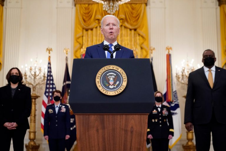 President Joe Biden speaks during an event to mark International Women's Day, Monday, March 8, 2021, in the East Room of the White House in Washington, as Vice President Kamala Harris, Defense Secretary Lloyd Austin, Air Force Gen. Jacqueline Van Ovost and Army Lt. Gen. Laura Richardson listen.