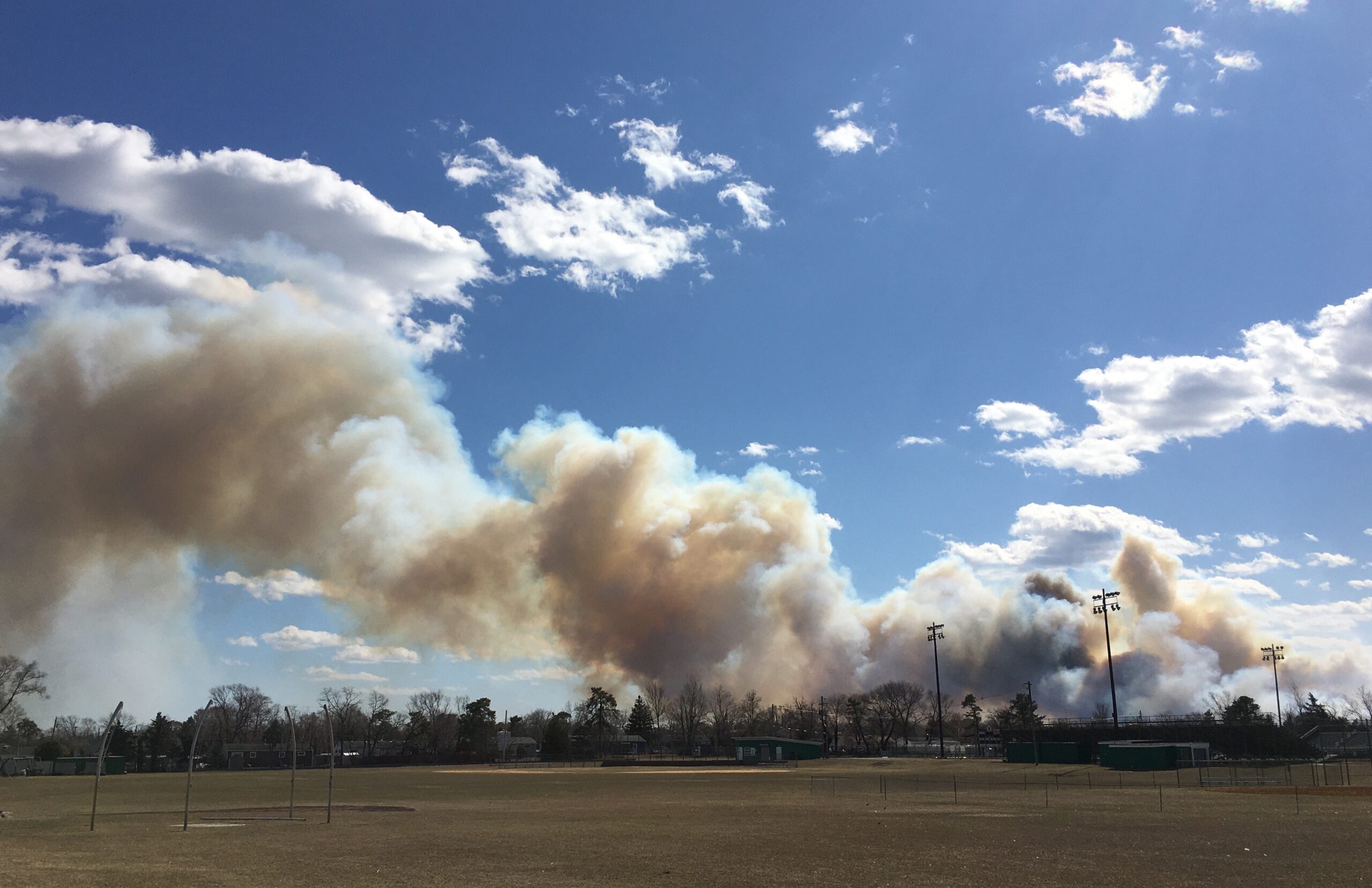 Rare New Jersey wildfire burns 170 acres, leaving firefighter in critical condition
