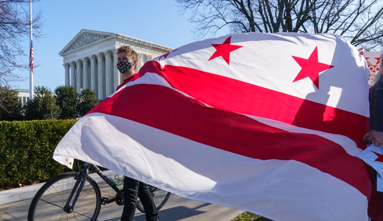 Advocates for statehood for the District of Columbia rally near the Supreme Court and Capitol prior to a House of Representatives hearing on creating a fifty-first state, in Washington, Monday, March 22, 2021. The activists were able to gather near the Capitol building after the outer perimeter security fencing was dismantled this weekend.