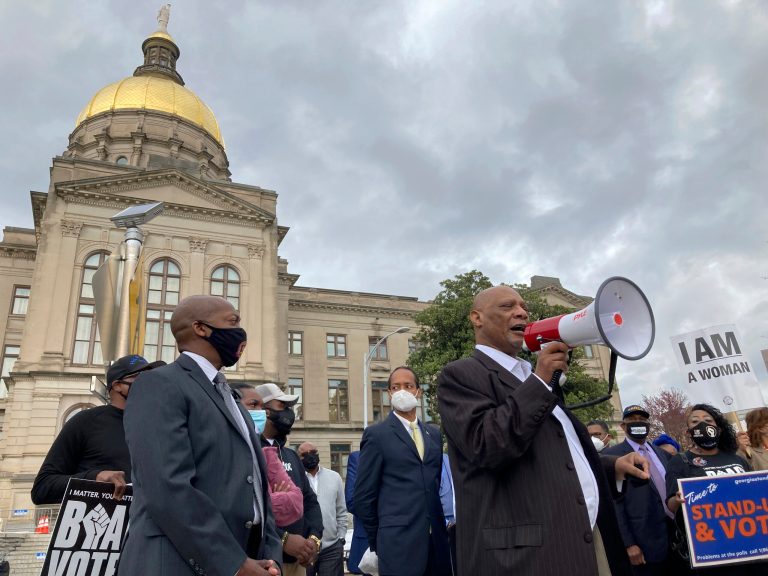 African Methodist Episcopal Church Bishop Reginald Jackson announces a boycott of Coca-Cola Co. products outside the Georgia Capitol on Thursday, March 25, 2021 in Atlanta.  Jackson says Coca-Cola and other large Georgia companies haven't done enough to oppose restrictive voting bills that Georgia lawmakers were debating as Jackson spoke.