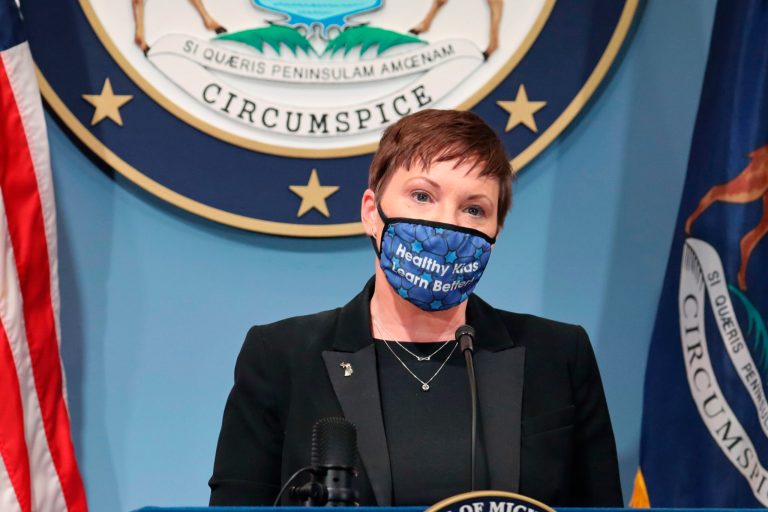 Michigan health director traveled out of state despite local guidance and spike in COVID-19 cases