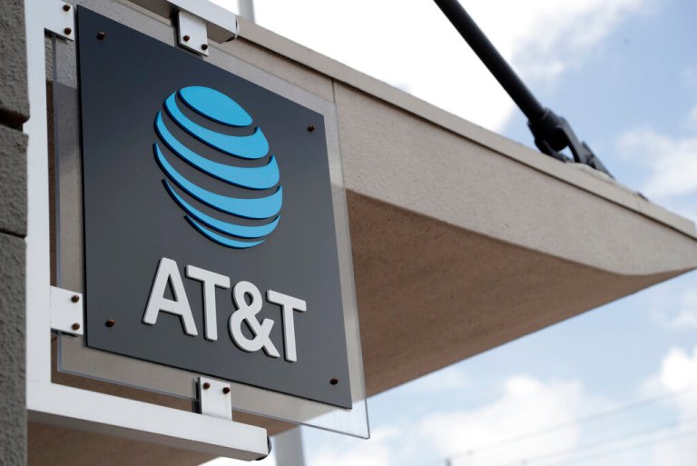 In this July 18, 2019, file photo, a sign is displayed at an AT&T retail store in Miami.