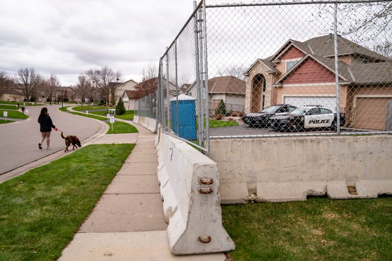 Wire fences and armed policemen protecting home of Kim Potter