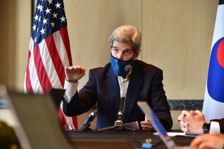 In this photo provided by U.S. Embassy Seoul, U.S. special envoy for climate John Kerry gestures while  speaking during a round table meeting with the media in Seoul, South Korea, Sunday, April 18, 2021. (U.S. Embassy Seoul via AP)