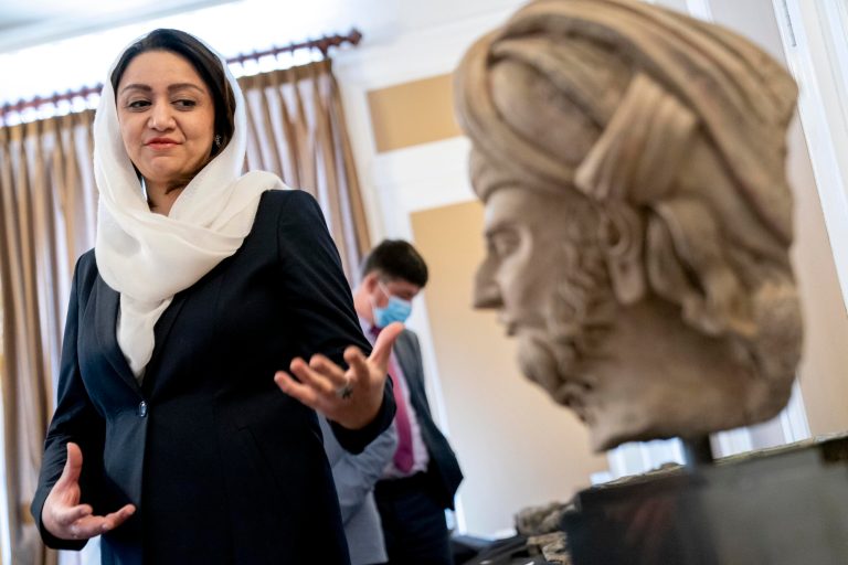 Afghan Ambassador to the U.S. Roya Rahmani, accompanied by embassy staff, speaks as she gives the Associated Press a tour at the Afghanistan Embassy in Washington, Wednesday, April 21, 2021, of looted and stolen Afghan religious relics and antiquities recovered by U.S. government authorities as part of a wider investigation into global trafficking in rare and ancient artifacts.