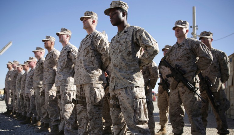 U.S. Marines watch during the change of command ceremony at Task Force Southwest military field in Shorab military camp of Helmand province, Afghanistan.