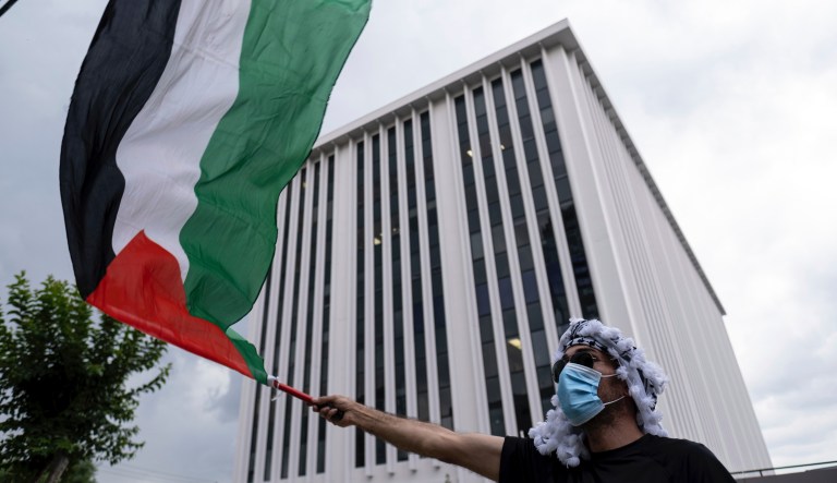 Several hundred pro-Palestinian protesters gather in front of the building housing the Israeli Consulate office in Midtown Atlanta on Tuesday evening, May 18, 2021.