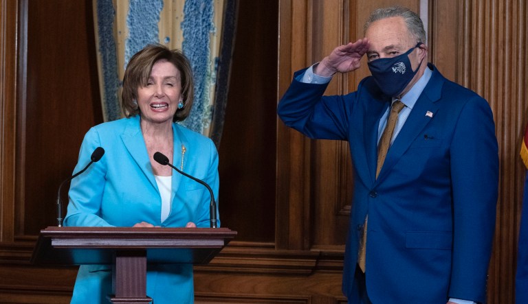 Speaker of the House Nancy Pelosi, D-Calif., and Senate Majority Leader Chuck Schumer, D-N.Y., during the signing ceremony of the COVID-19 Hate Crime Act, on Capitol Hill in Washington, Wednesday, May 19. 2021.