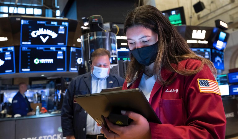In this photo provided by the New York Stock Exchange, trader Ashley Lara works on the trading floor, Tuesday, May 25, 2021. Stocks were slightly higher in early trading Tuesday, adding to gains from the day before as technology companies and homebuilders helped push the market higher.
